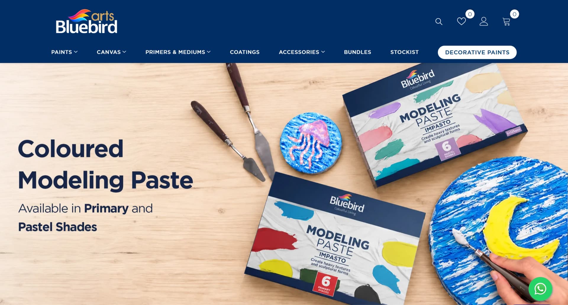 bluebirdarts.pk, the first screen: the Bluebird Arts logo and menu over a photograph of modeling paste boxes, palette knives and two textured paintings
