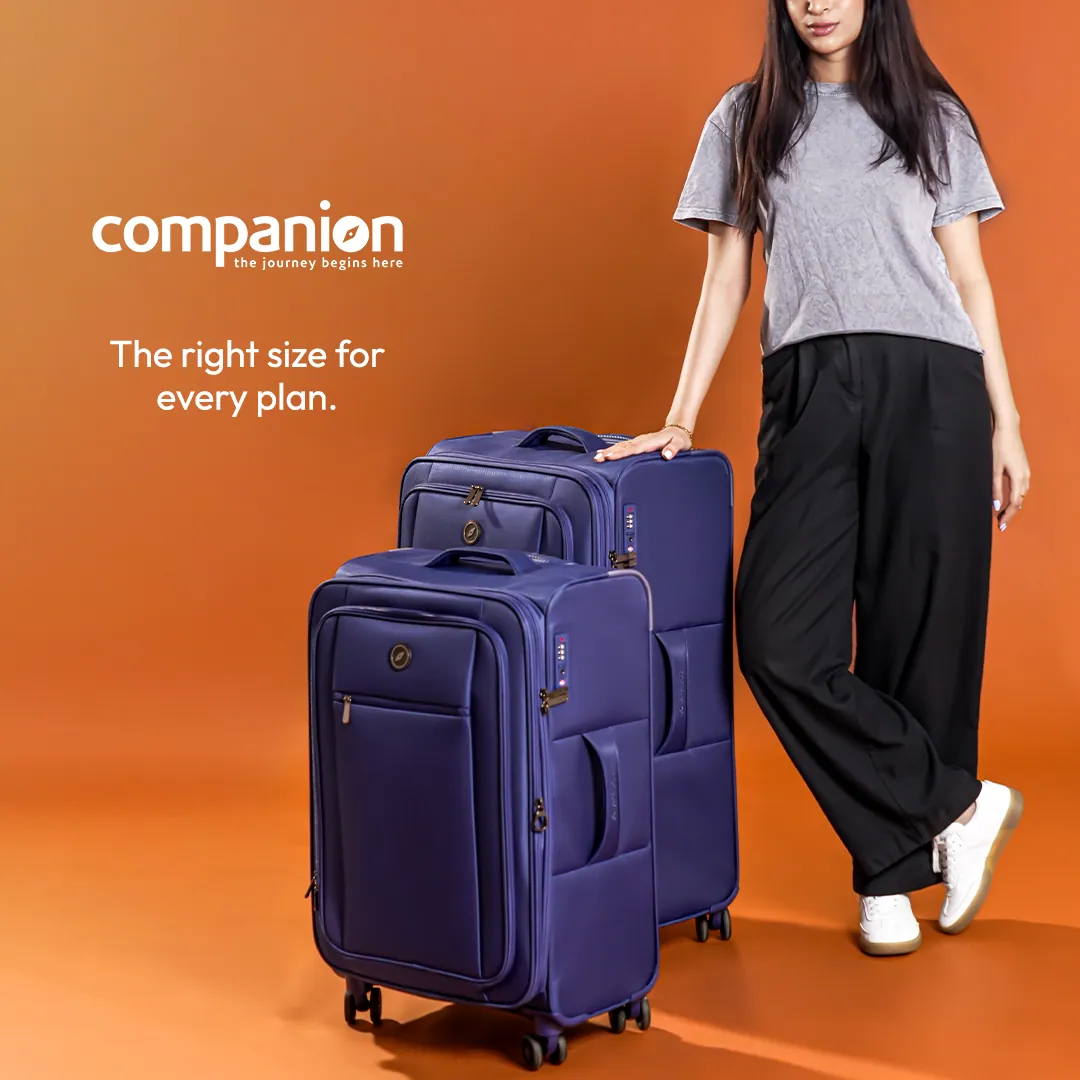 Ad: two navy soft-shell suitcases, large and small, beside a person in a grey T-shirt and black trousers, with the words The right size for every plan