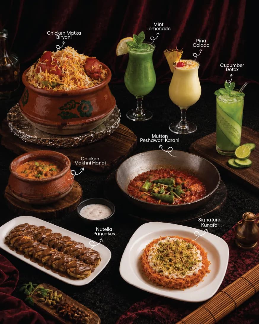 A dark menu page of signature dishes from above: biryani in a clay pot, curries, kebabs and drinks, each named