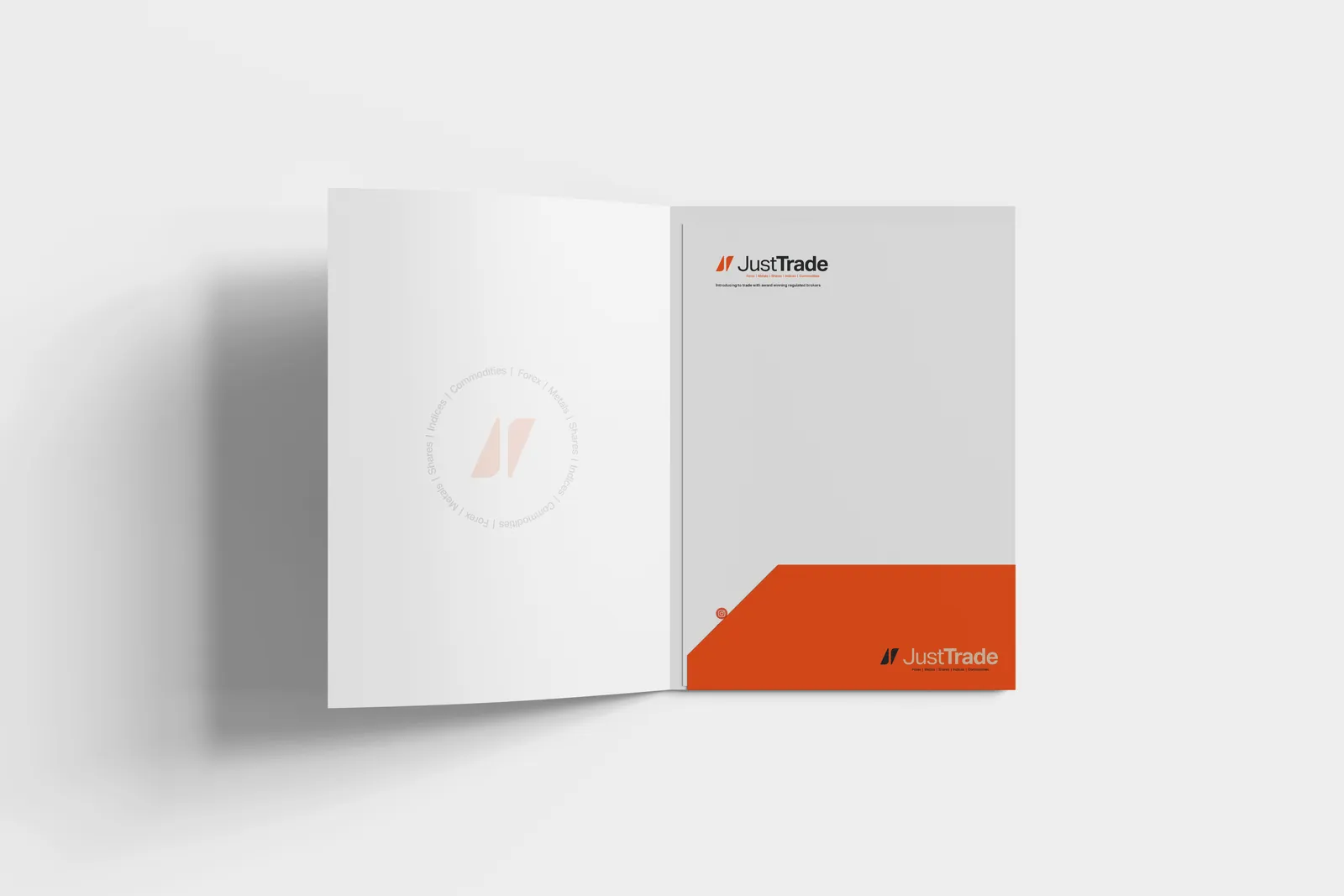 An open white Just Trade presentation folder with an orange pocket and the logo, on grey