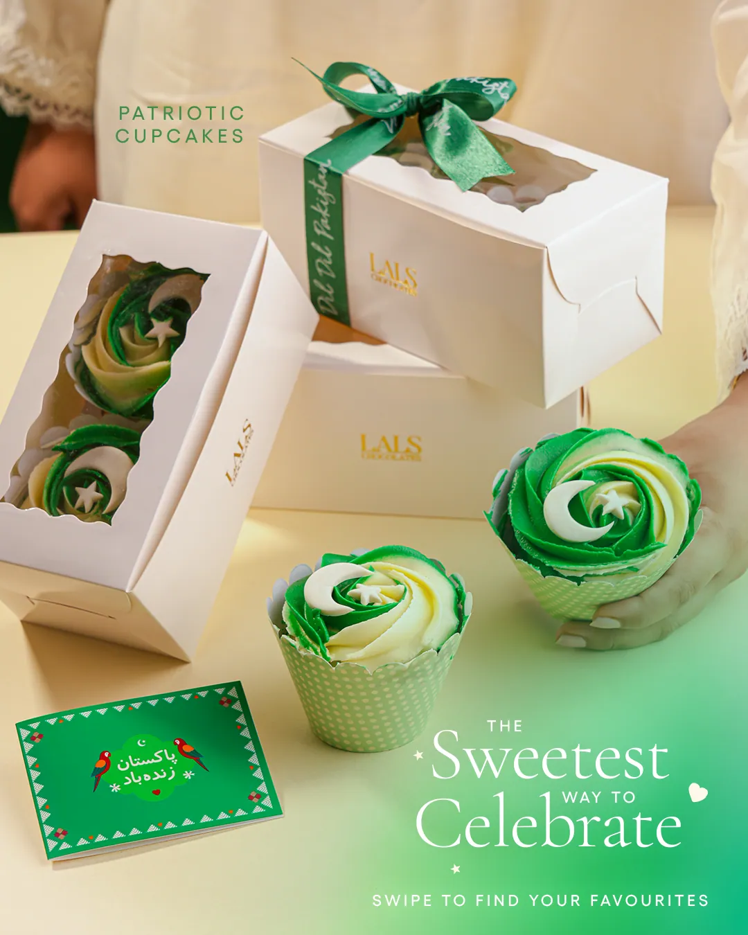 Green and white swirled cupcakes in white boxes tied with green ribbon, with the words The sweetest way to celebrate