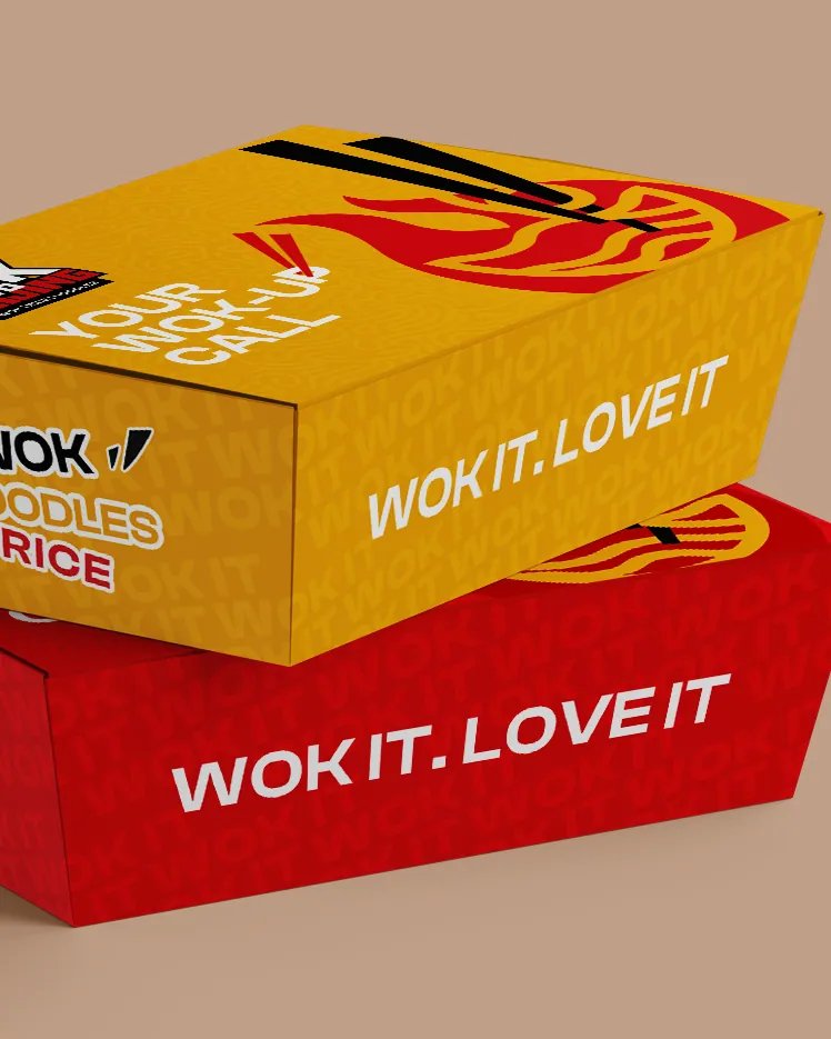 Yellow and red Wok to Beijing takeaway boxes printed Wok it. Love it